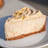 Rich, creamy Lebkuchen cheesecake with a swirl of cinnamon frosting, perfect for dessert.