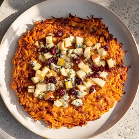 Golden and crispy potato pancakes topped with creamy Gorgonzola-apple compote, a delightful main dish.