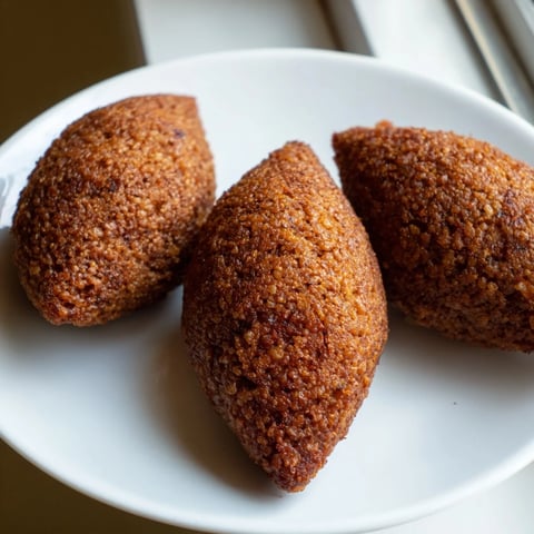 Crisp, golden Lebanese Kibbeh with a savory aroma, ready to savor as a delicious appetizer.